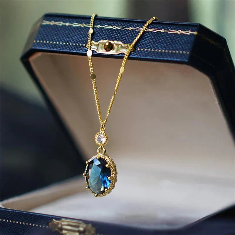 Gold geometric pendant necklace on a chain, showcasing a retro French-inspired copper design.