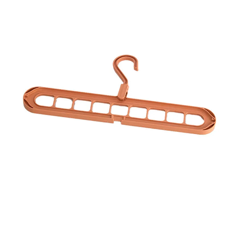 Multifunctional plastic hanger with nine holes for folding trousers, shown in beige