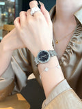 Starry Sky Fritillary Marble women's watch with 32mm dial, metal case, and steel strap