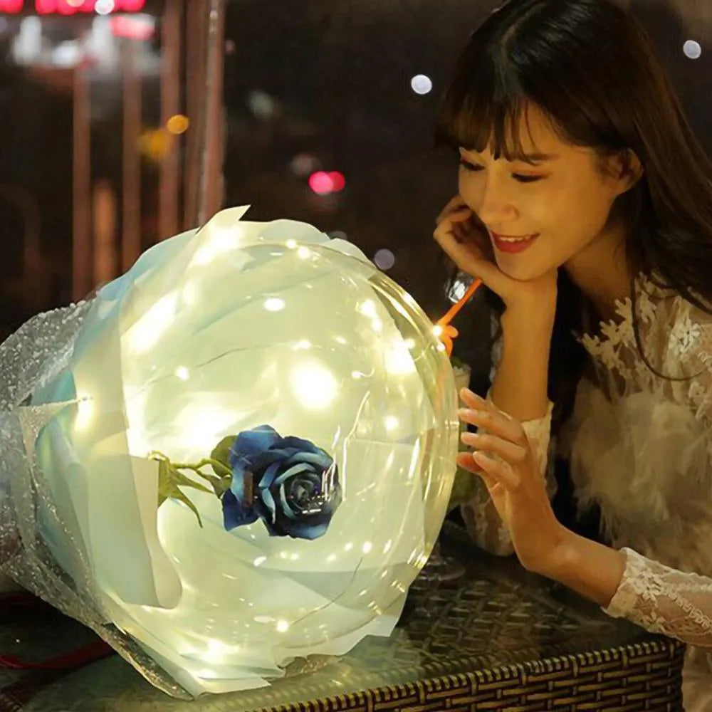 Transparent LED luminous balloon with artificial rose inside glowing with built-in light