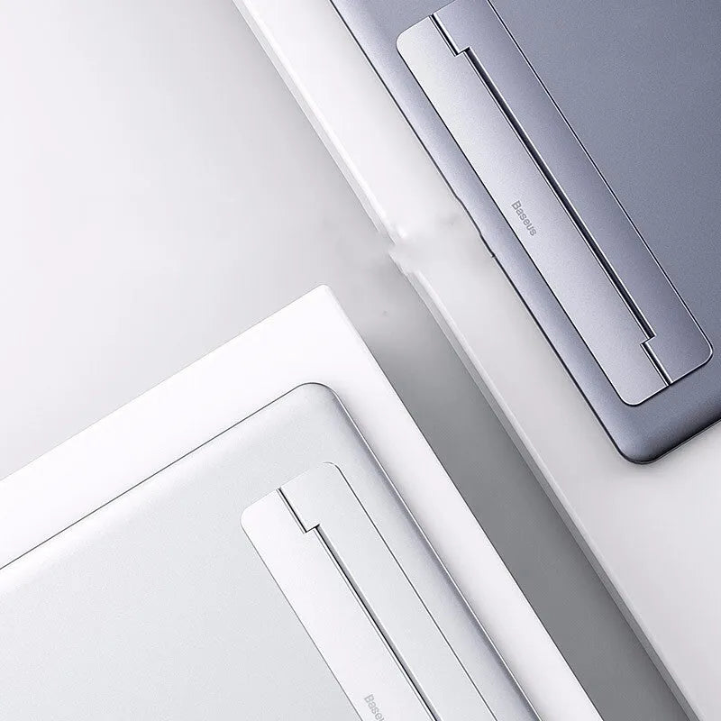 Invisible paste foldable computer stand in grey aluminum alloy, 227mm long, 3mm thick, folded flat on desk