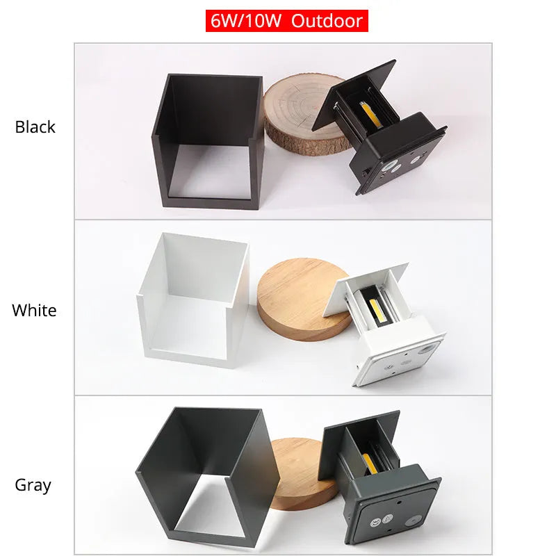 Square black aluminium alloy wall lamp mounted on a corridor wall