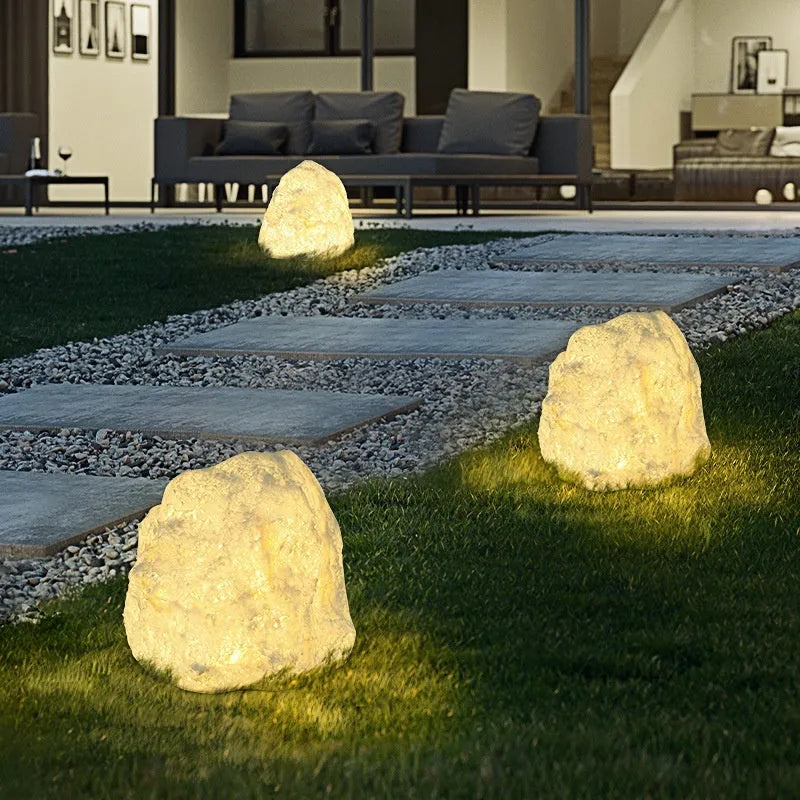 Outdoor waterproof stone resin floor lamp with warm light on garden pathway