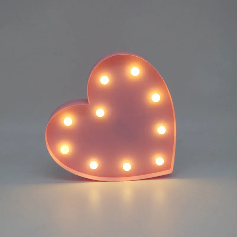 3D love heart marquee letter lamp in pink or red, 26.5cm x 4.0cm x 27.5cm, warm white LEDs, indoor wall or freestanding decoration