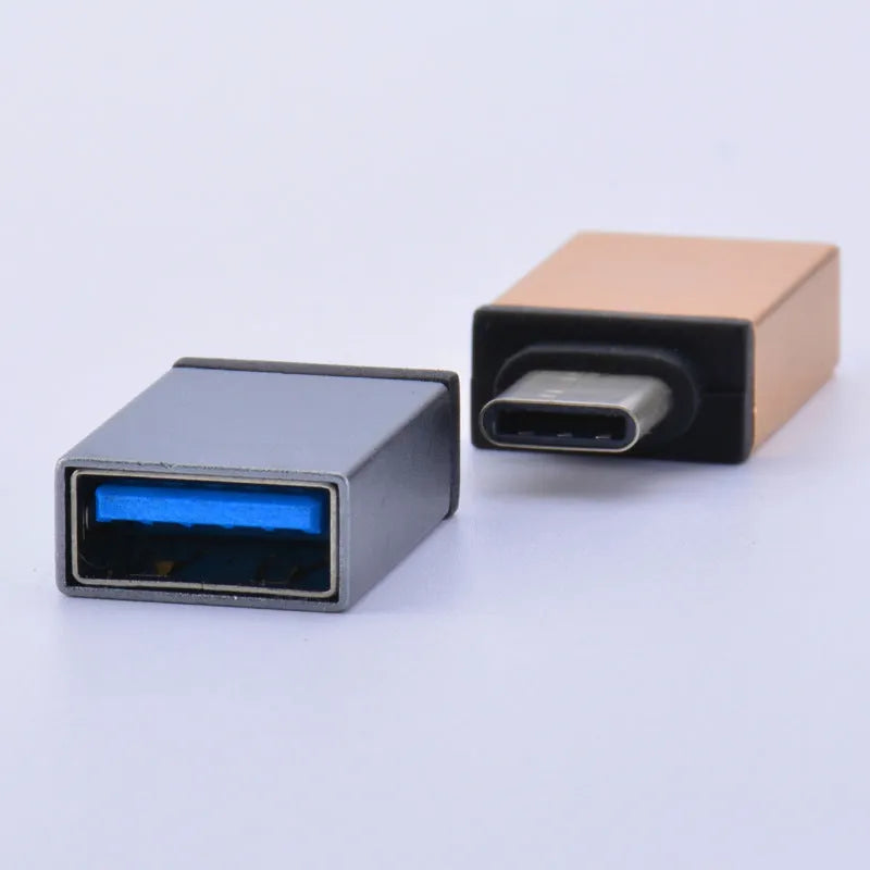 Metal Type-C mobile phone adapter in gold colour with universal connectivity
