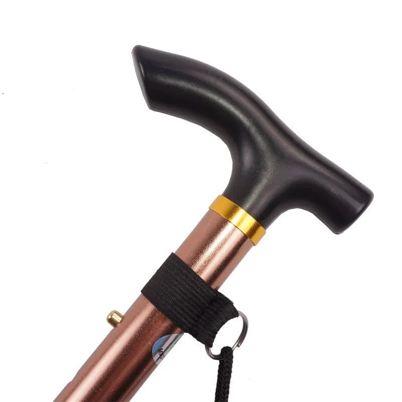 Aluminium folding walking stick extended to show adjustable shaft and non-slip rubber tip.