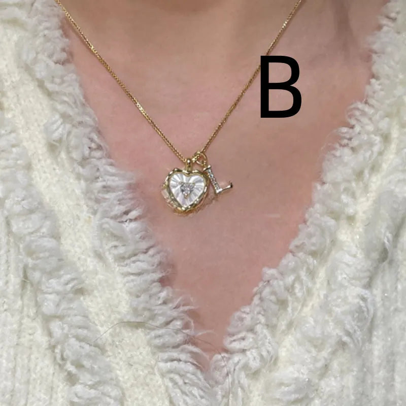 Women's pendant necklace with titanium steel chain and natural mother-of-pearl in heart-shaped design