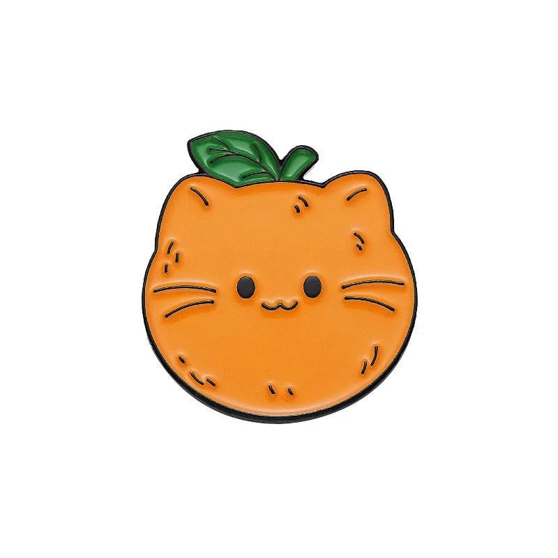 Colourful cartoon-style fruit metal brooch with a pin back on a denim jacket lapel.