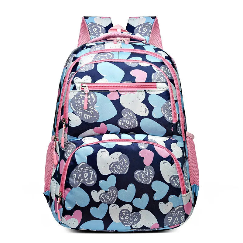 Blue children's school backpack with air pillow straps on a grey background.