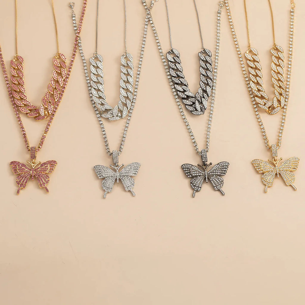 Butterfly-shaped alloy pendant necklace with rhinestone accents, gold electroplated finish