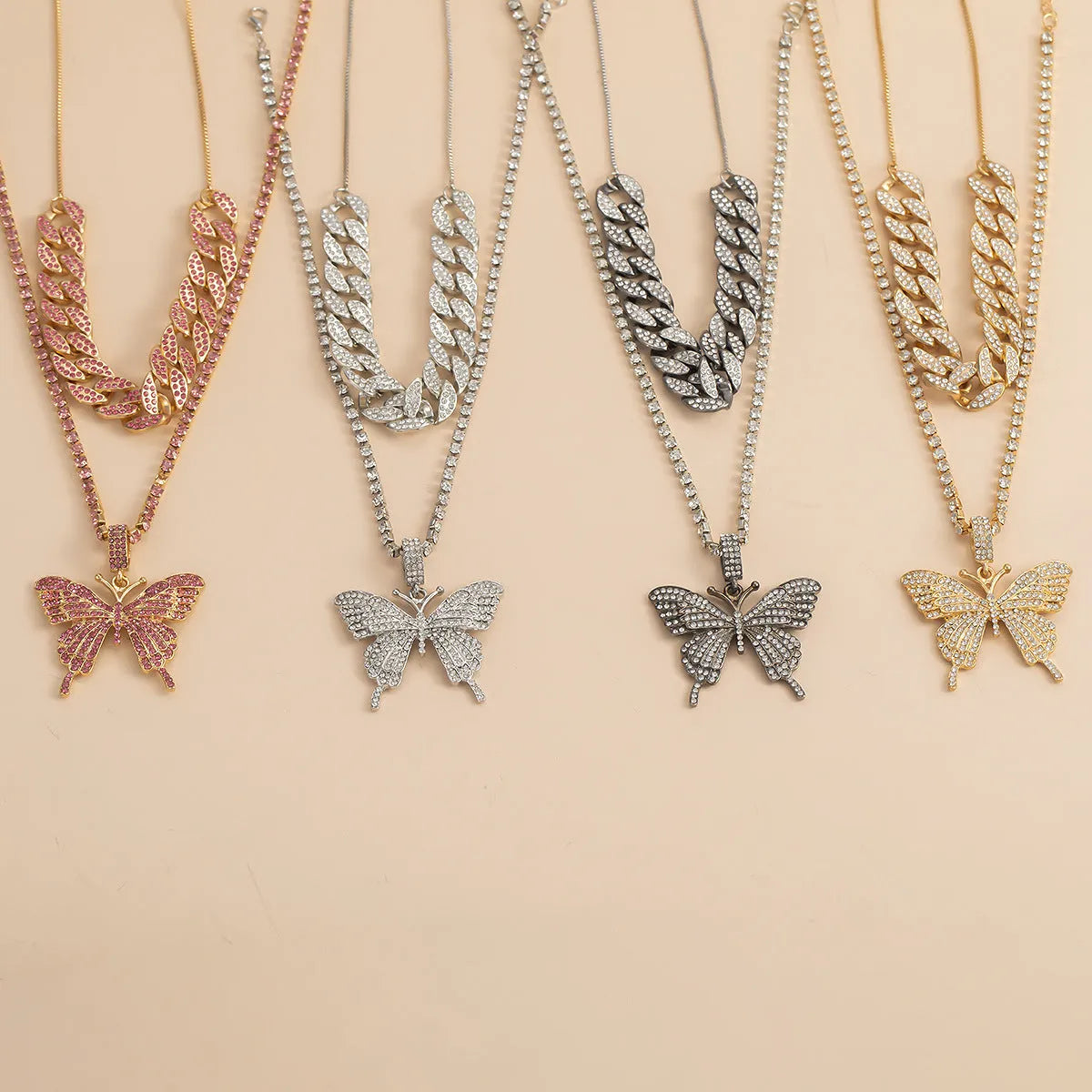 Butterfly-shaped alloy pendant necklace with rhinestone accents, gold electroplated finish