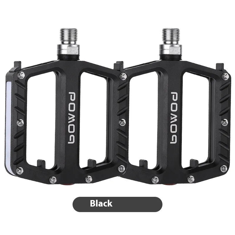 Bicycle pedal with LED lights in aluminium alloy construction, showing multiple colour options