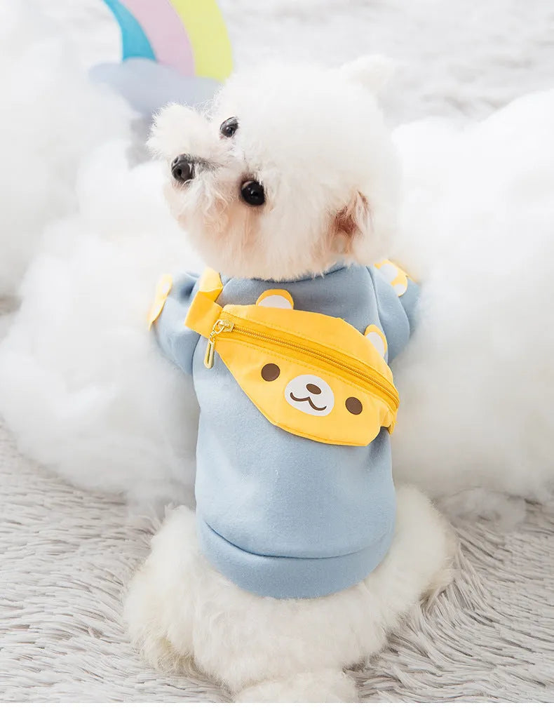 Blue cartoon backpack pet clothes milk silk sweater on small dog in side view