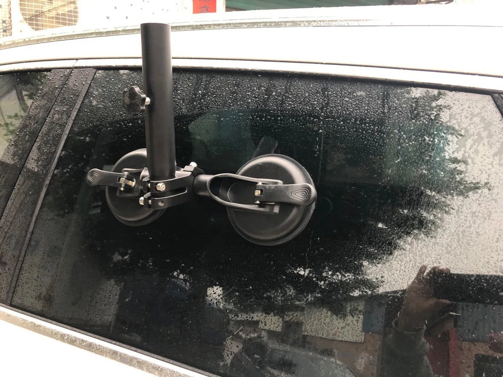 Black off-road car glass sucker base with round rubber disc for windscreen mounting.