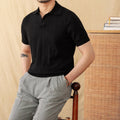 Men's purple short sleeve polo top with a knitted sunken stripe pattern and a classic collar.