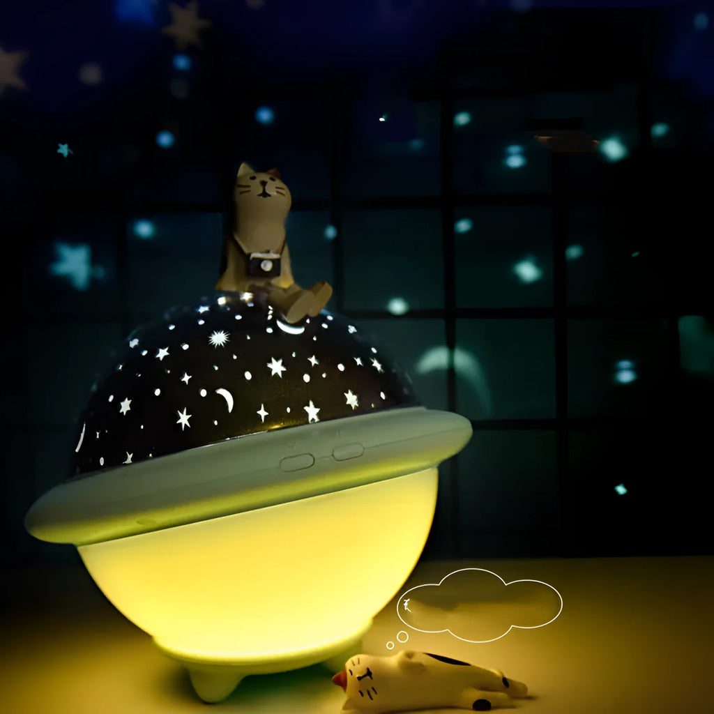 Green UFO-shaped plastic LED night light projecting a starry sky pattern, shown with a USB cable.