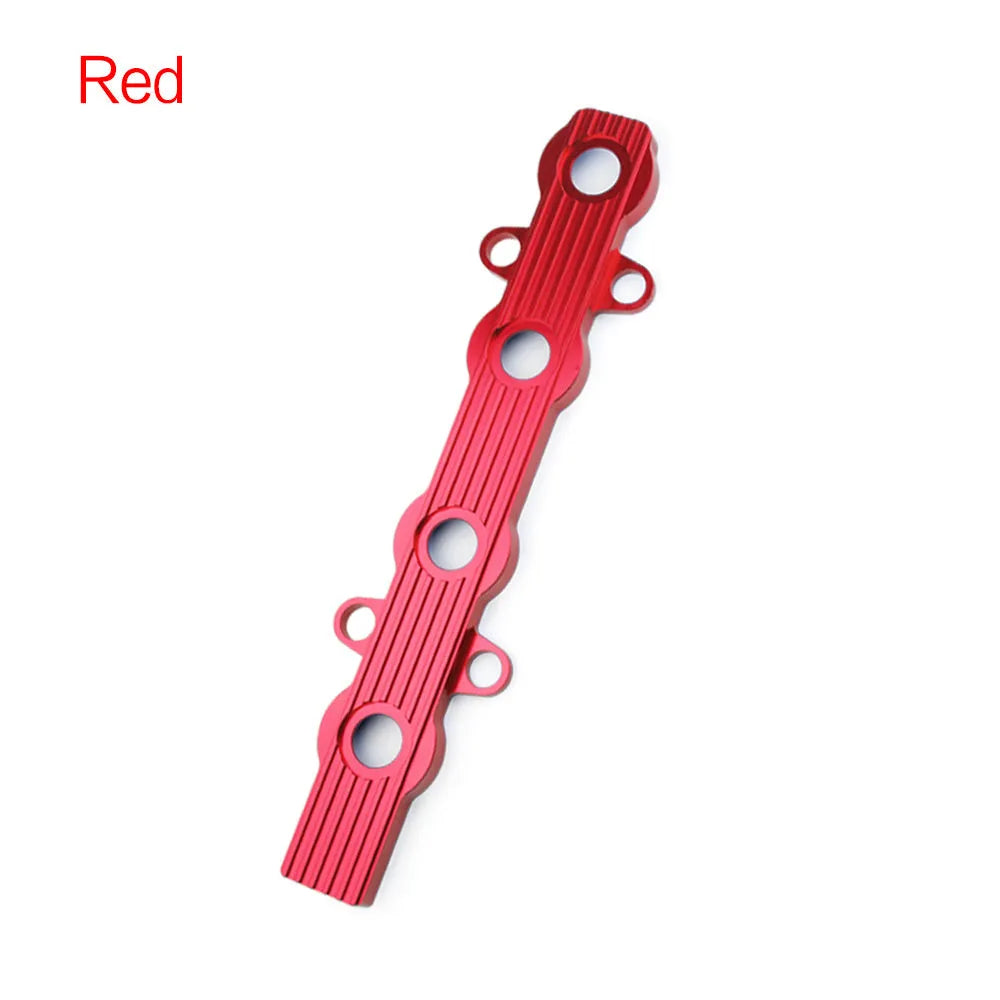 Aluminium engine harness housing bracket in blue, red, and silver, showing variants with and without mounting holes.