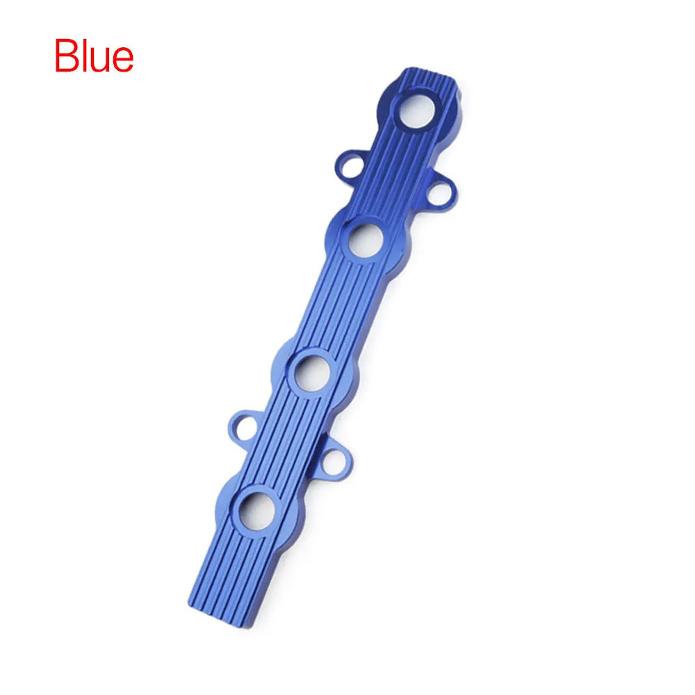 Aluminium engine harness housing bracket in blue, red, and silver, showing variants with and without mounting holes.