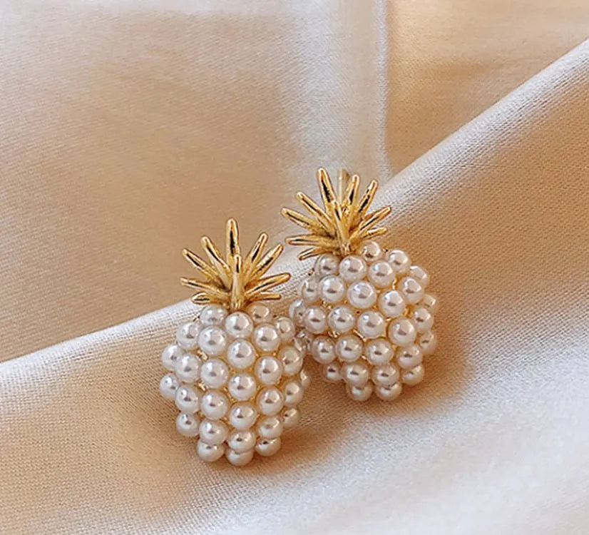 Women's gold Korean style alloy earrings with pineapple and starfish charms inlaid with artificial gems.