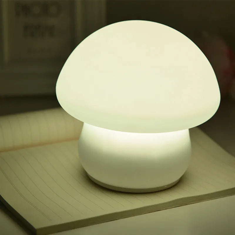 White silicone mushroom night lamp with USB cable showing cold and warm light modes