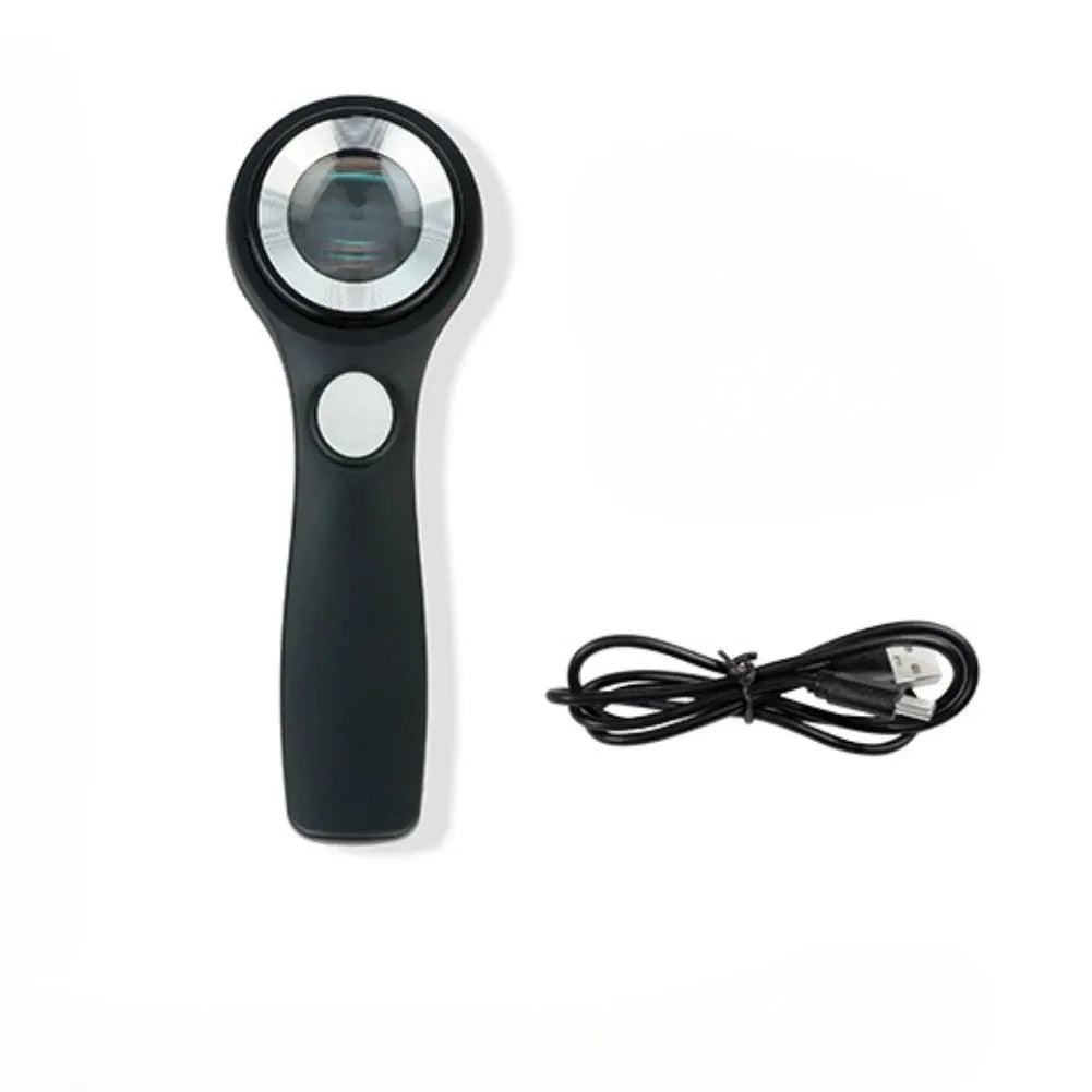 Black and silver electronic magnifying glass for jewellery appraisal with 30X lens and USB C cable.