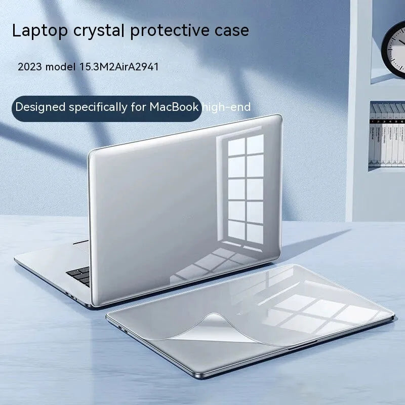 MacBook Pro laptop with a crystal transparent protective hard shell case snapped onto its lid and base.