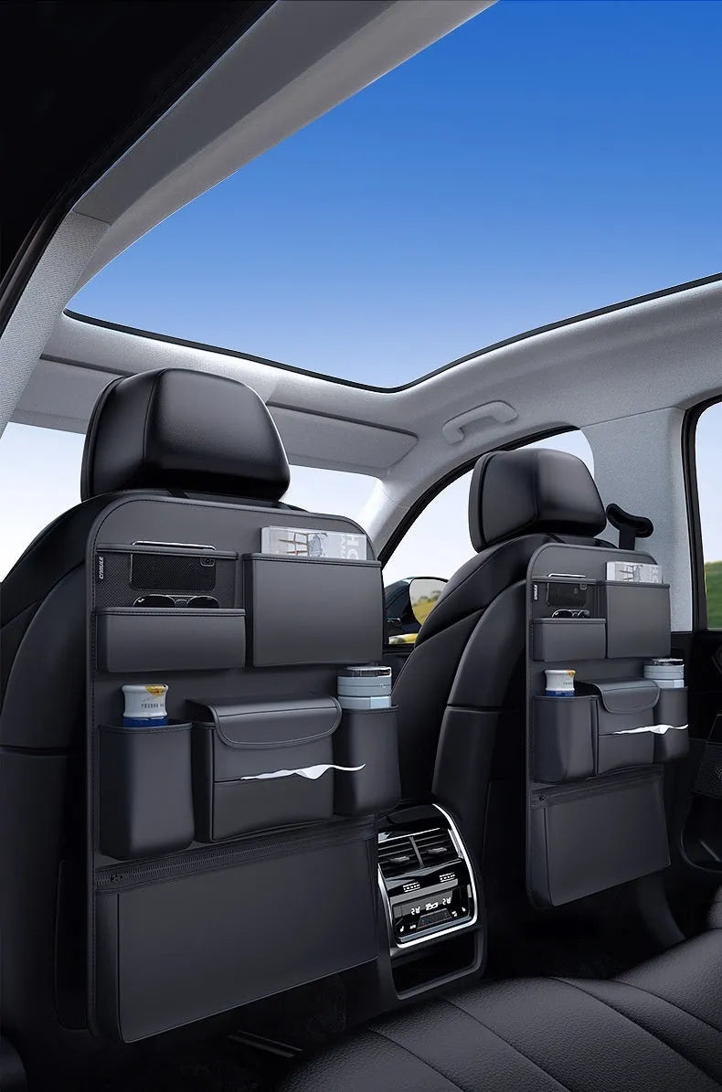 Black genuine leather car seat back hanging storage bag with a carry handle.