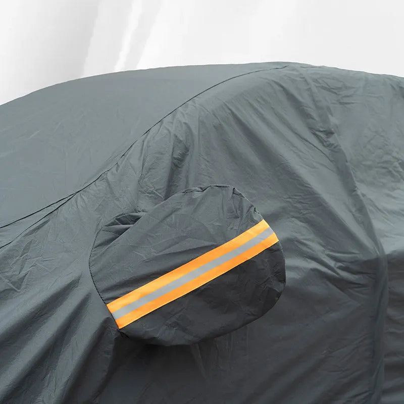 Grey PVC car cover for Volkswagen models shown fitted on a car, illustrating rainproof and sun protection design.
