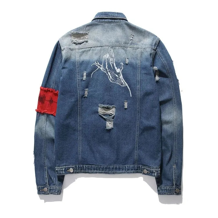 Blue embroidered cotton denim jacket for women on model, showing decorative stitching on front panels