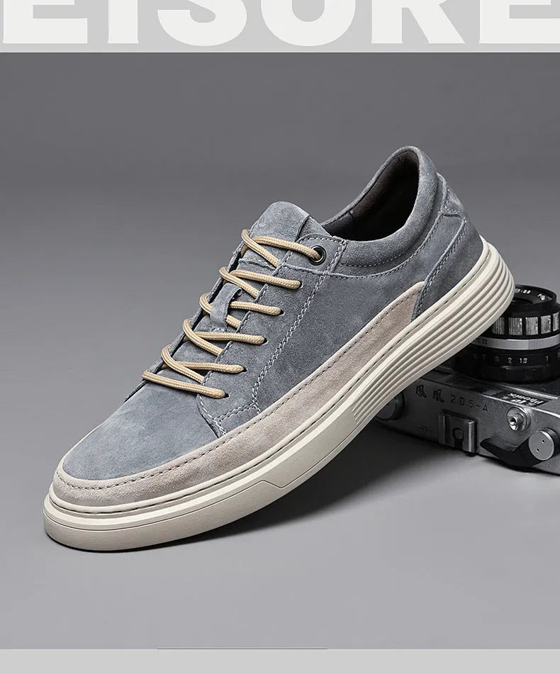 Men's gray casual skate shoes with pigskin upper and rubber sole on a white background.