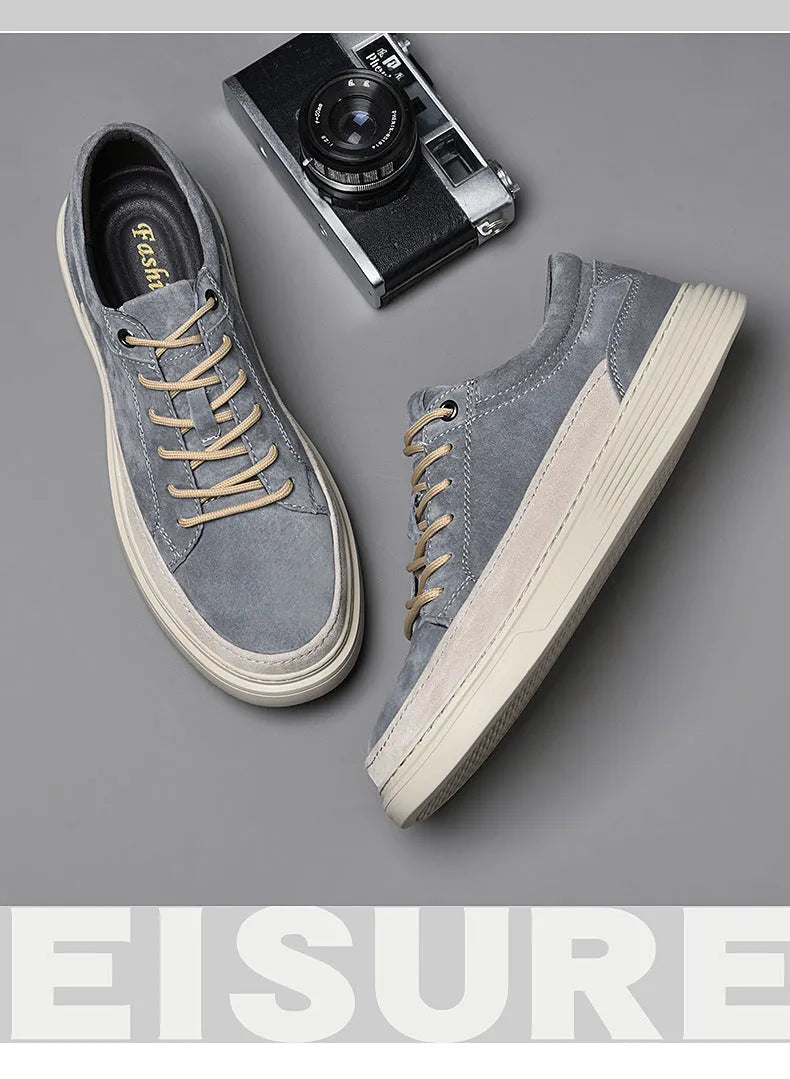 Men's gray casual skate shoes with pigskin upper and rubber sole on a white background.
