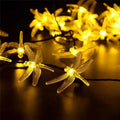 Outdoor solar LED string lights with dragonfly solar panel showing 5 metre length and IP65 waterproof construction