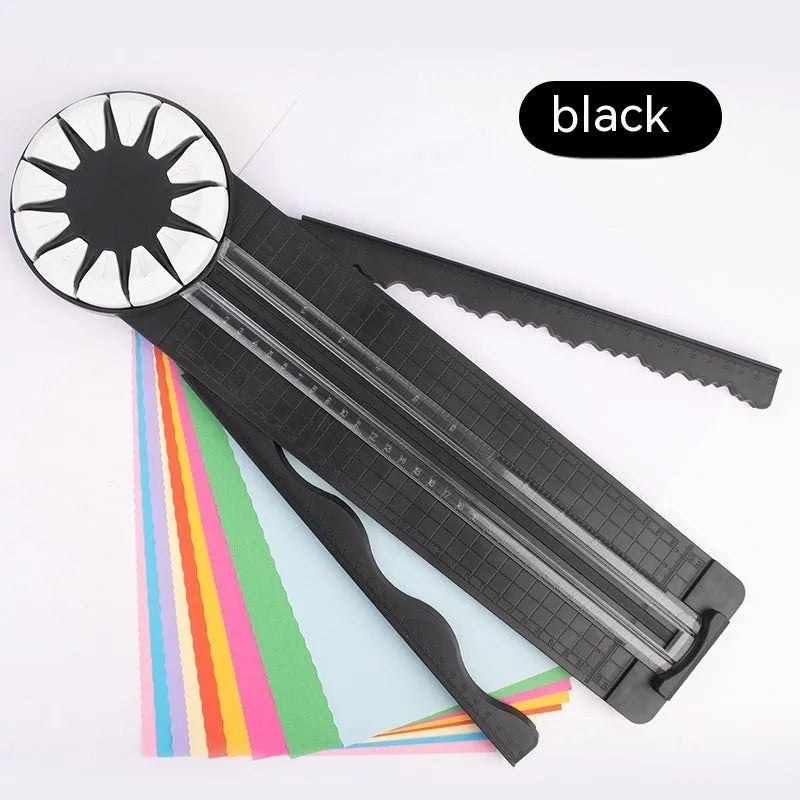 Pink plastic desktop paper cutting machine with a rotary blade for 12 different decorative edge patterns.