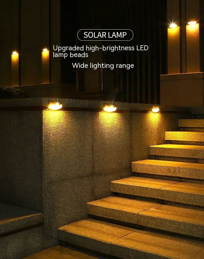 Solar-powered outdoor wall lamp with a smiling face design in a garden setting.