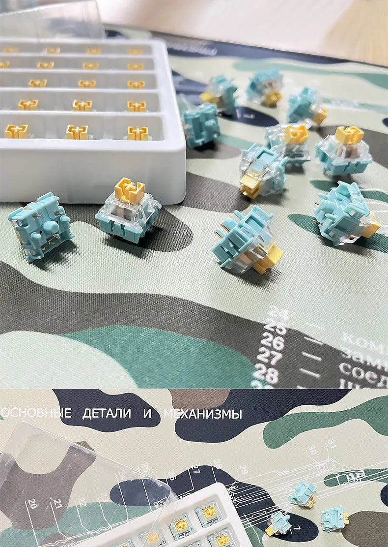 36 Sea Salt Lemon coloured mechanical keyboard switches with 3-pin connectors laid out on a table.