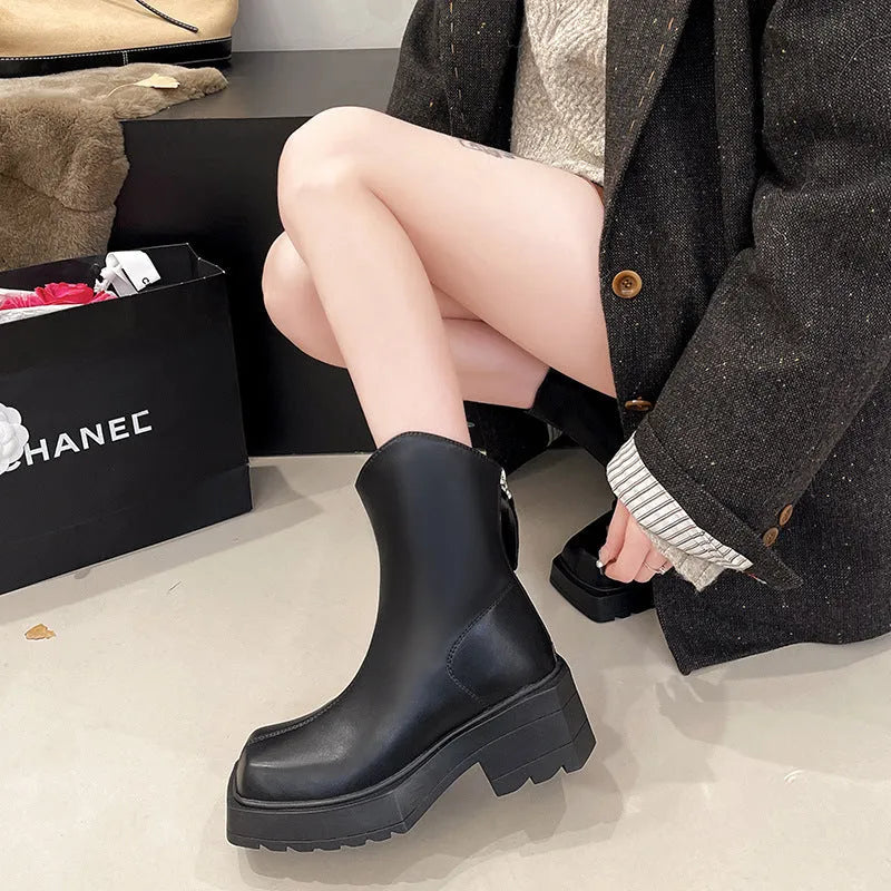 Black and brown women's square toe platform Martin boots with a mid calf height and back zipper.