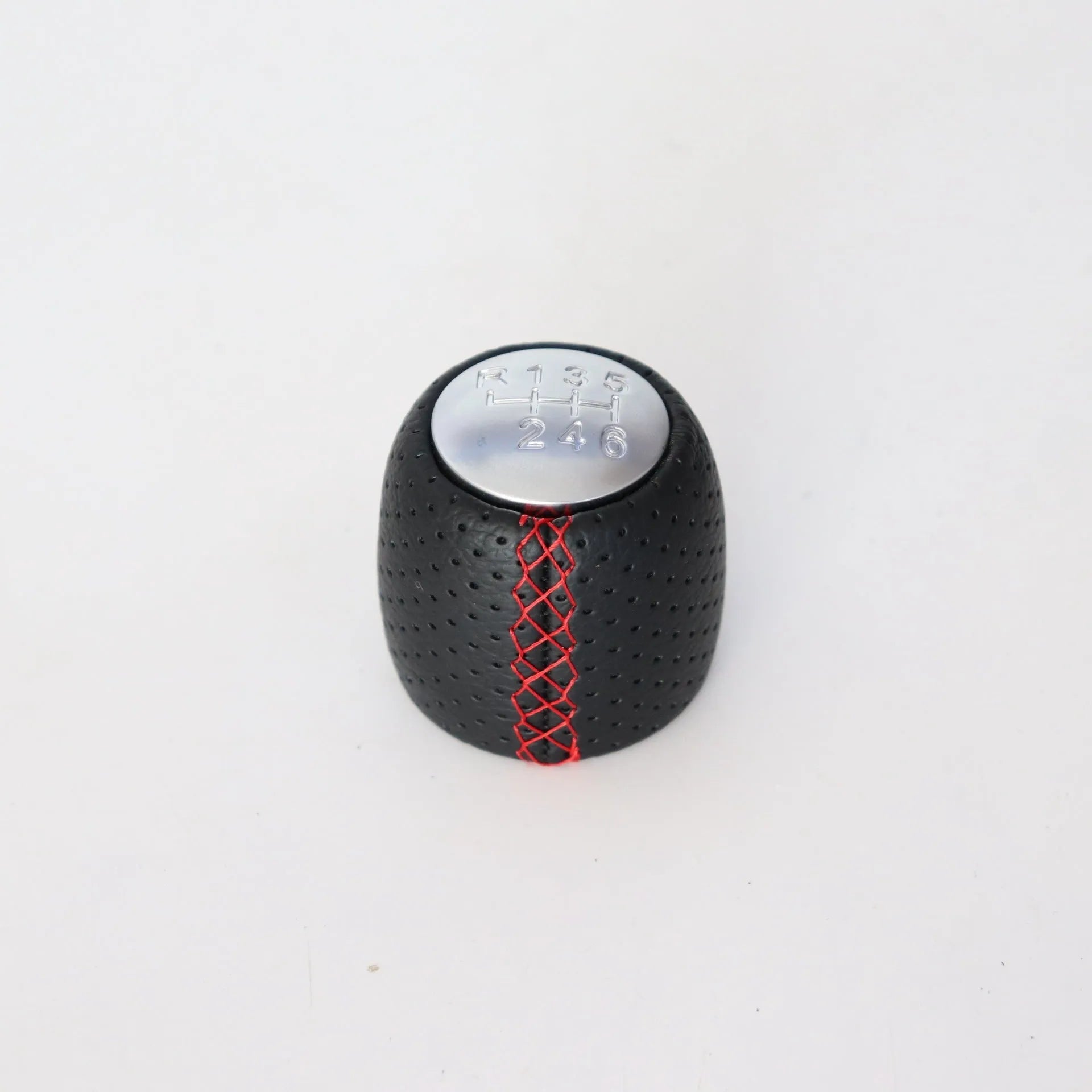 Perforated leather gear shift handball for Alpha car in black, red, and white line colour options.