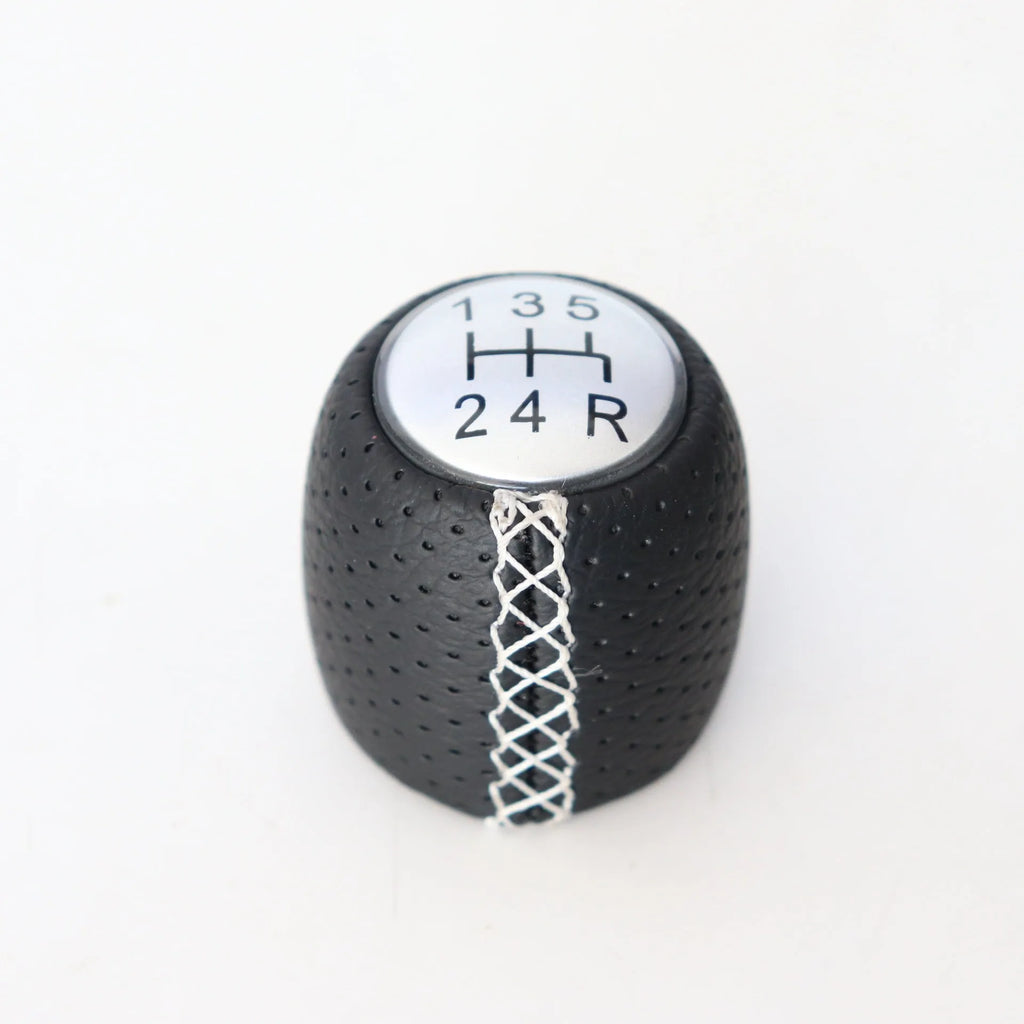 Perforated leather gear shift handball for Alpha car in black, red, and white line colour options.