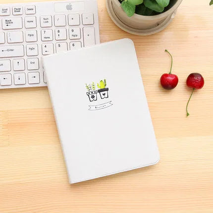 Leather handbook notebook 36K with 112 beige pages closed, showing blue red and white colour options