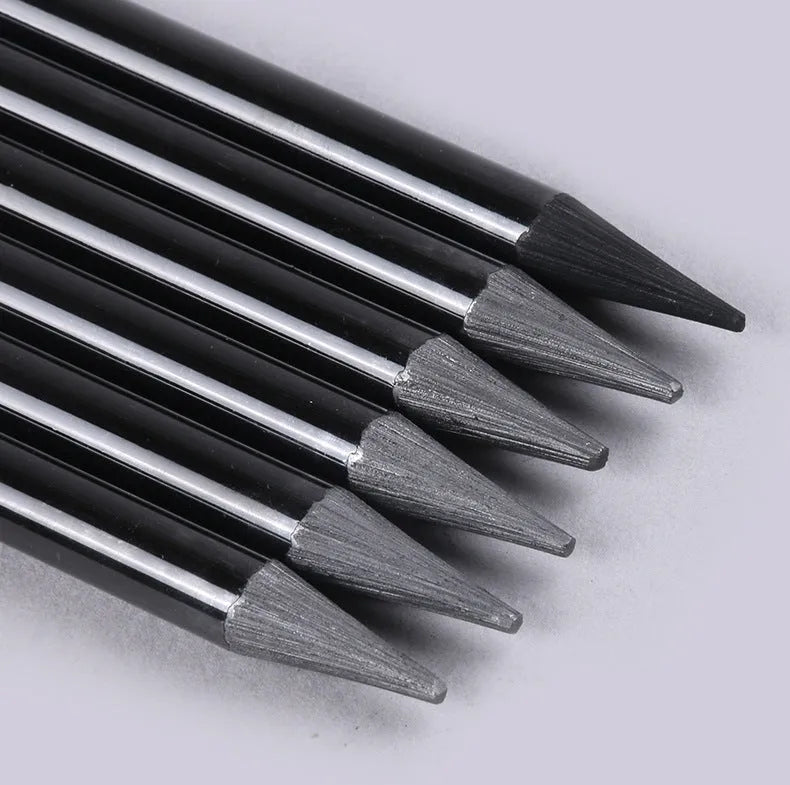 Wooden case containing six graphite pencils and three carbonized pencils for drawing, presented on a white suction card.