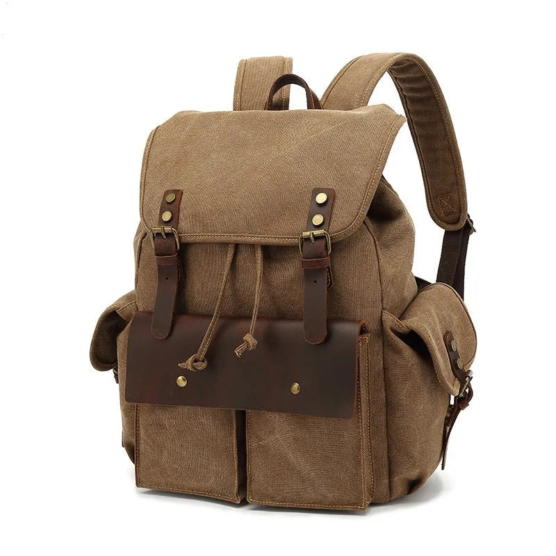 Retro canvas backpack in military green with antique bronze hardware showing front compartment organisation