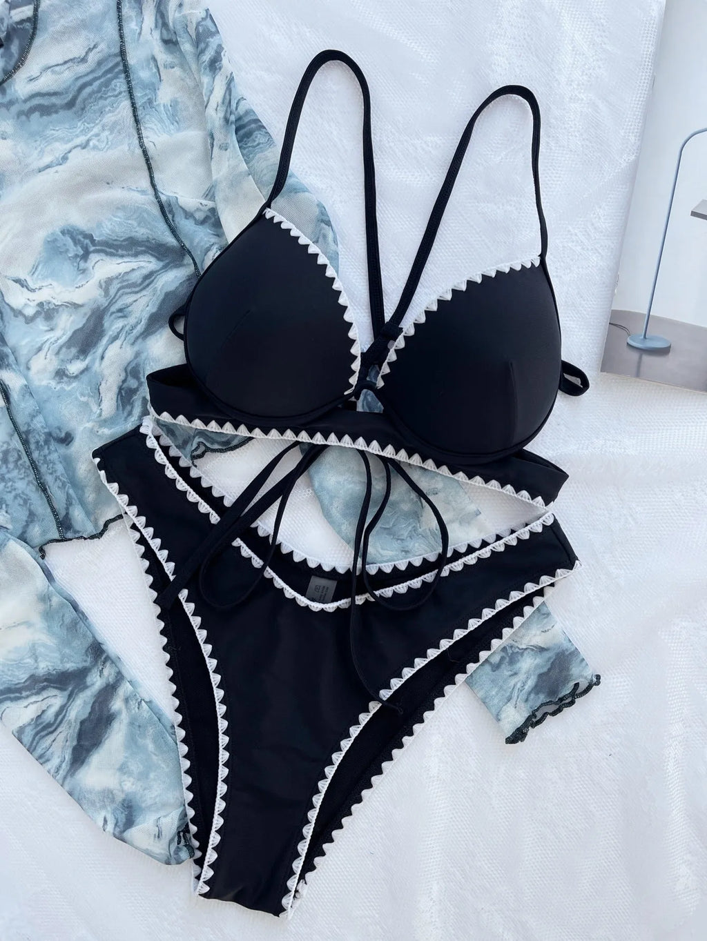Women's black nylon split bikini swimsuit two-piece set in sizes S, M and L