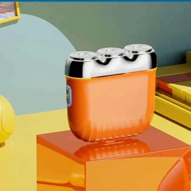 A mini three-head magnetic electric shaver in gun colour, orange, green, or blue, shown with its floating cutter head.