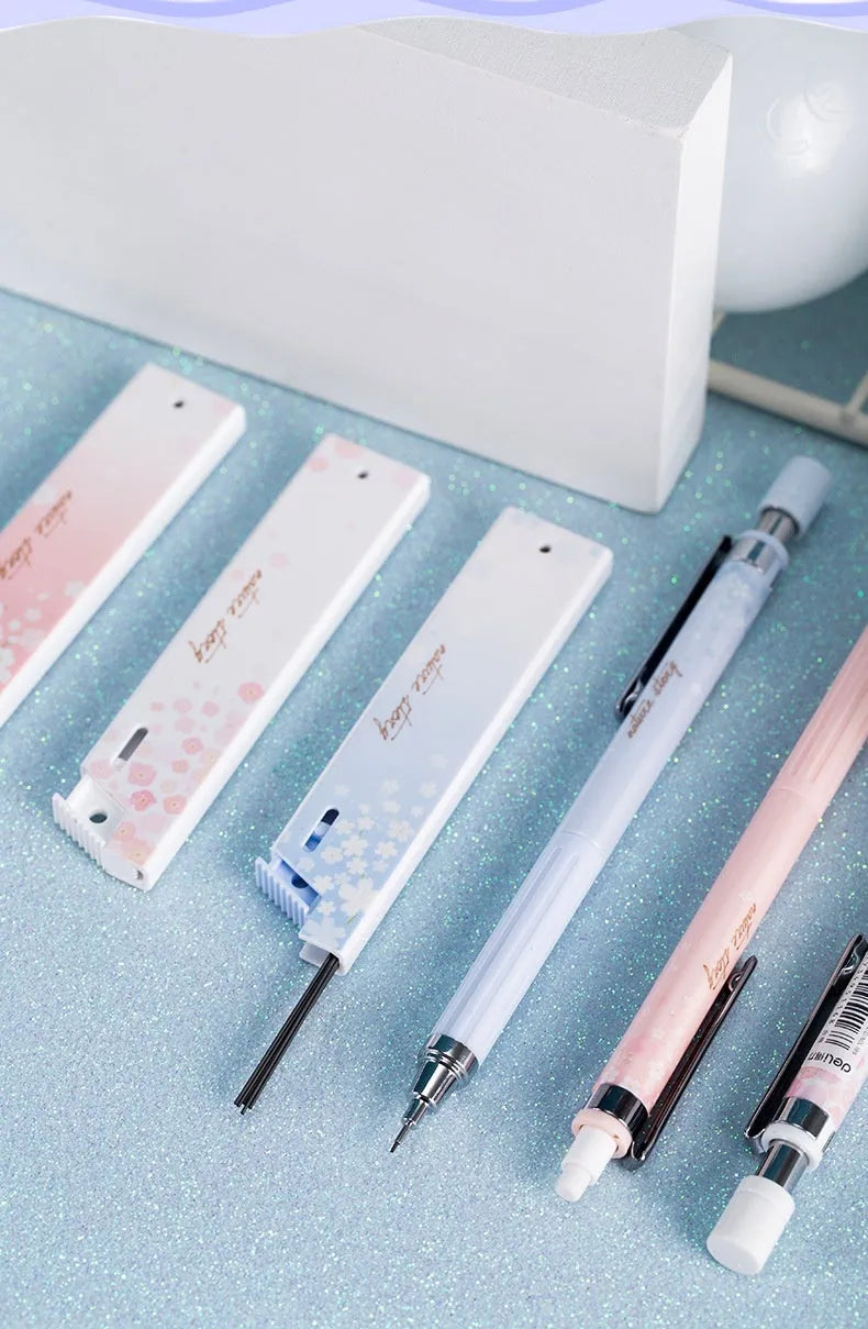 Mixed colour cartoon style 0.5mm automatic pencil set with three pencils and three boxes of HB refills.