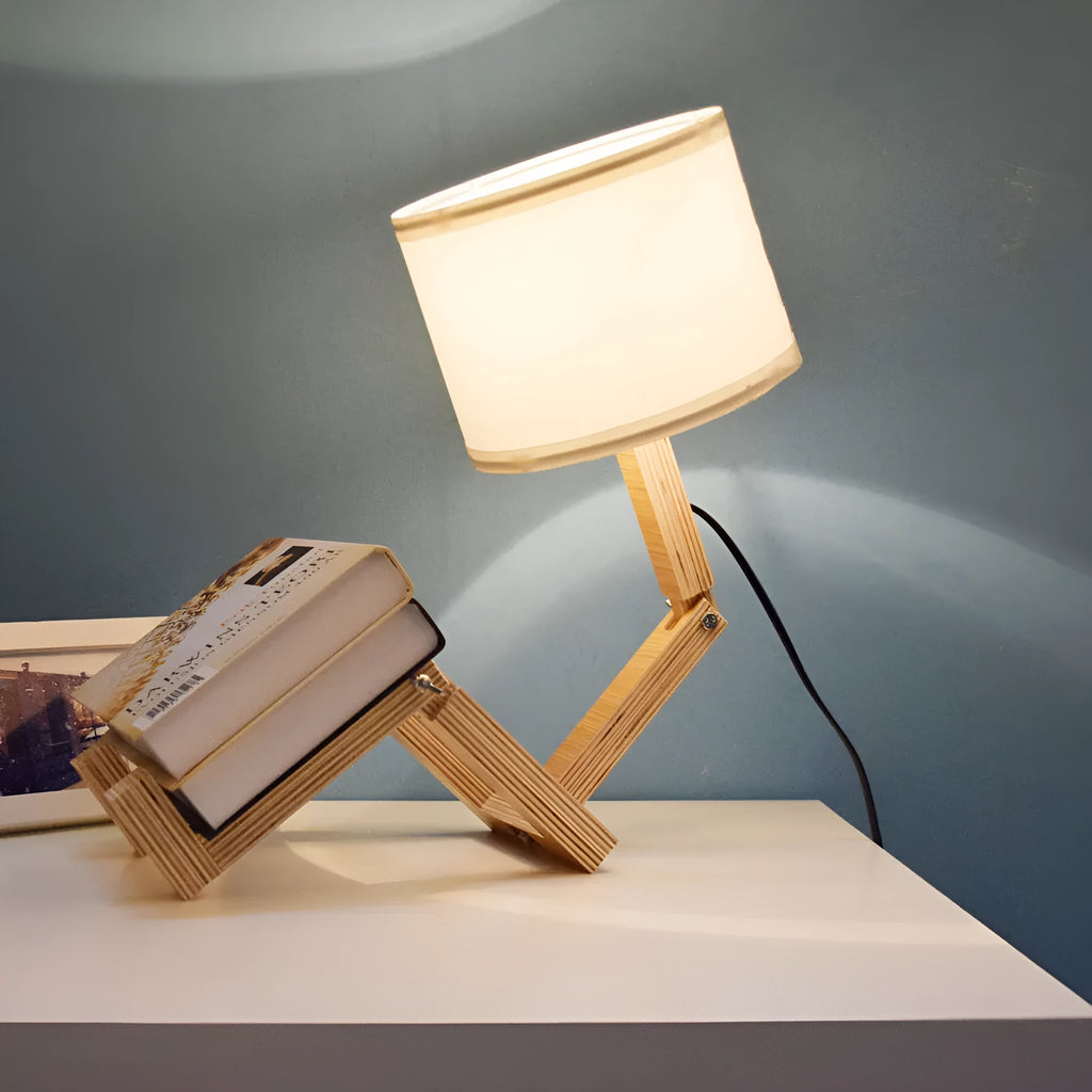 Creative humanoid wooden table lamp with white fabric shade measuring 22x44x16cm