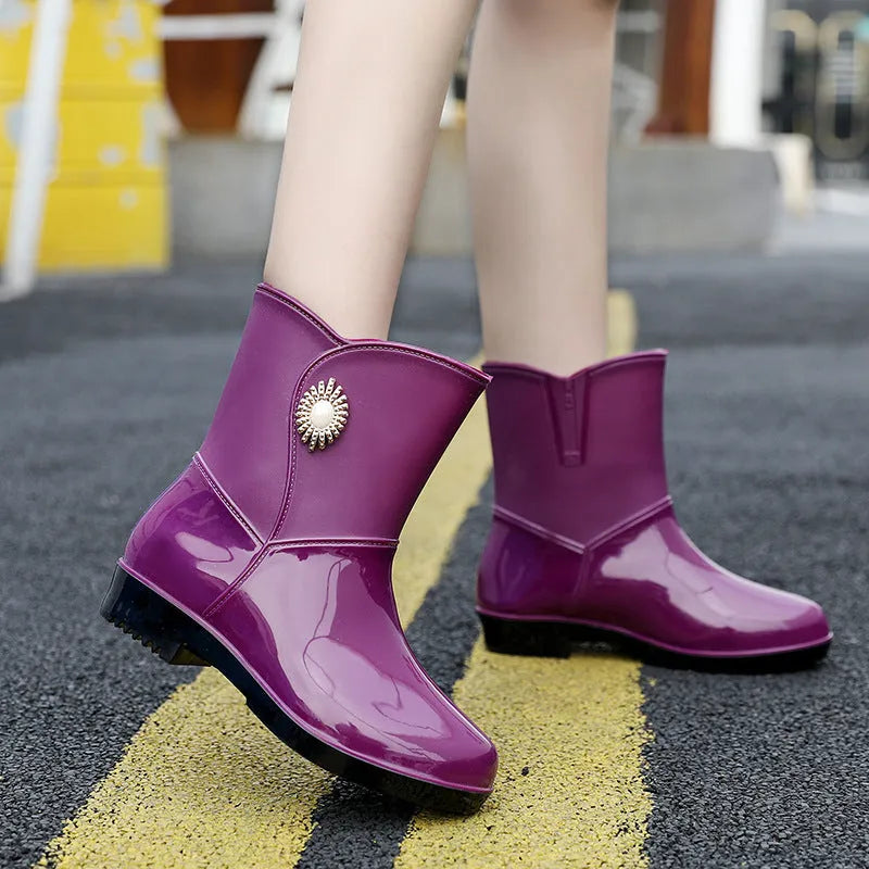 Women's purple PVC rain boots with non-slip sole and middle tube height