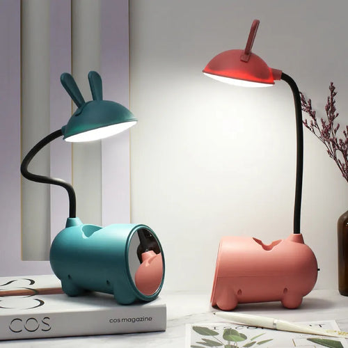 Cartoon-themed desktop table lamp with integrated pen container in green colour