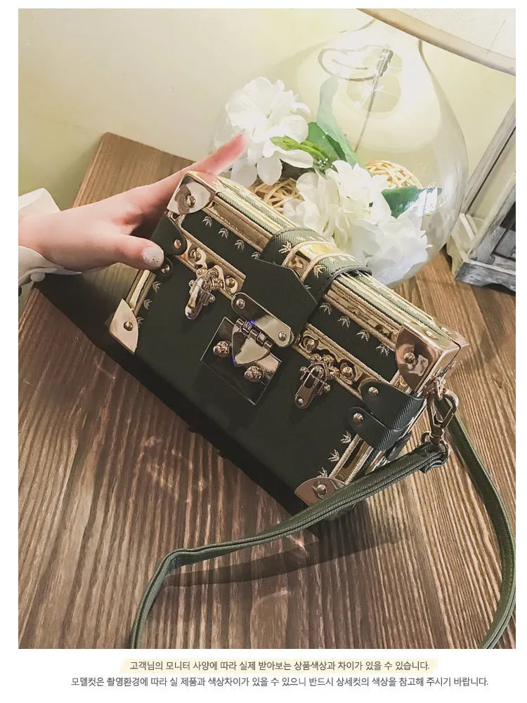 Women's hard-shell PU shoulder and crossbody handbag with hasp closure in black or green.