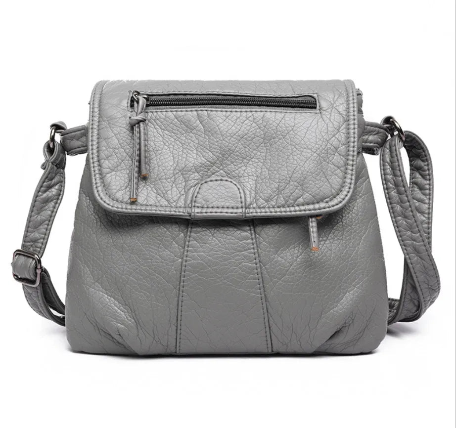 REPRCLA women's black crossbody messenger bag in soft PU leather, 25cm x 22cm x 3cm, two-layer design