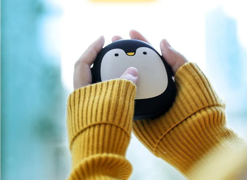 Cartoon penguin and polar bear USB rechargeable hand warmer and power bank showing double-side heating